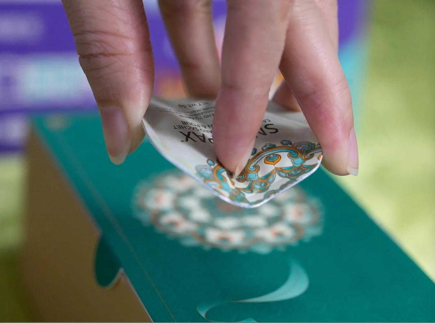 Fold the card along its central opening line.