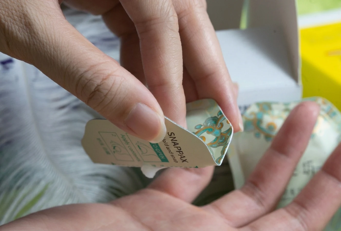 Press the flexible surface to dispense the contents.